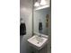 Well-lit powder room featuring a classic pedestal sink and decorative elements at 1829 S Lee St # C, Lakewood, CO 80232