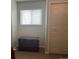 Cozy area featuring a window, carpeted flooring, and a large antique storage trunk at 1829 S Lee St # C, Lakewood, CO 80232