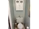 Charming powder room boasts a stylish overhead cabinet for storage and decor, adding to the home's appeal at 1829 S Lee St # C, Lakewood, CO 80232