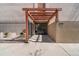 Building entrance featuring a pergola, black iron fence, and glass doors with natural light at 1390 N Emerson St # 406, Denver, CO 80218