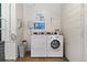Clean, community laundry room with modern washers and dryers for resident use at 1390 N Emerson St # 406, Denver, CO 80218