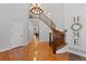 Elegant entryway with hardwood floors and a winding staircase at 588 Tolland Ct, Castle Rock, CO 80108