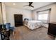 Bright bedroom featuring carpet, a ceiling fan, and a window seat beneath a large window at 1781 E 97Th Ave, Thornton, CO 80229