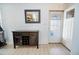 Functional entryway with a dark wood cabinet, mirror, and access to the back door at 1781 E 97Th Ave, Thornton, CO 80229