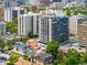 Stunning aerial view of high-rise condos surrounded by lush greenery and city views at 790 N Washington St # 1210, Denver, CO 80203