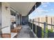 Relax on this condo's spacious balcony featuring plenty of seating and city views at 790 N Washington St # 1210, Denver, CO 80203