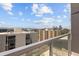 Balcony view showcasing city skyline and distant mountains, framed by a modern railing at 790 N Washington St # 1210, Denver, CO 80203