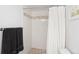 Shower featuring stylish tile surround, mosaic accent, and neutral shower curtain at 790 N Washington St # 1210, Denver, CO 80203