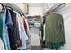 Organized walk-in closet with shelving and hanging rods for ample storage at 790 N Washington St # 1210, Denver, CO 80203