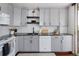 Updated kitchen featuring grey cabinets, black countertops and stainless appliances at 790 N Washington St # 1210, Denver, CO 80203