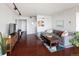 Comfortable living room with hardwood floors, modern lighting, and a stylish sectional sofa at 790 N Washington St # 1210, Denver, CO 80203