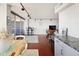 Open living room with sleek hardwood floors, minimalist decor, and sliding glass door access at 790 N Washington St # 1210, Denver, CO 80203