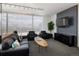 Inviting resident lounge with comfortable seating and a TV, providing a relaxing space with great views at 790 N Washington St # 1210, Denver, CO 80203