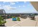 A rooftop deck featuring seating arrangements and colorful planters with an expansive city view at 790 N Washington St # 1210, Denver, CO 80203