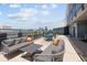 Rooftop lounge featuring outdoor seating and dining tables with scenic city views at 790 N Washington St # 1210, Denver, CO 80203