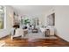 Bright and airy living room with a cozy fireplace and large windows at 17 Polo Club Dr, Denver, CO 80209