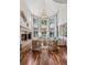 Bright and airy living room with tall windows, fireplace, and stylish furnishings at 17 Polo Club Dr, Denver, CO 80209