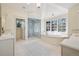 Luxurious main bathroom featuring a soaking tub, walk-in shower, and dual vanities at 17 Polo Club Dr, Denver, CO 80209