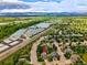 Overhead view featuring the residence near local lakes and a verdant landscape at 301 Widgeon Ln, Longmont, CO 80503