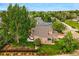 Aerial view of a home with a well-maintained lawn, garden area and hot tub set amongst lush landscaping at 301 Widgeon Ln, Longmont, CO 80503