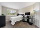 Cozy bedroom features a desk and computer setup, perfect for work or study at 301 Widgeon Ln, Longmont, CO 80503