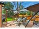 Inviting deck with dining area and comfortable seating, perfect for enjoying outdoor meals and relaxation at 301 Widgeon Ln, Longmont, CO 80503