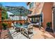 Relaxing deck space with shade umbrella and porch swing with room for outdoor entertaining and relaxing at 301 Widgeon Ln, Longmont, CO 80503
