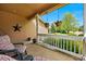 Relaxing front porch with cozy seating and hanging flower baskets, perfect for enjoying a peaceful afternoon at 301 Widgeon Ln, Longmont, CO 80503