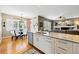Bright, open kitchen featuring granite countertops, stainless steel appliances, and a view of the dining area at 301 Widgeon Ln, Longmont, CO 80503