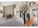 Open-concept living space with soaring ceilings and a formal dining area nearby at 301 Widgeon Ln, Longmont, CO 80503