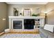 The living room has a fireplace, a TV, built-in shelving, and space for decorations at 301 Widgeon Ln, Longmont, CO 80503