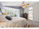 Spacious main bedroom featuring a seating area and a view to the ensuite bathroom at 301 Widgeon Ln, Longmont, CO 80503