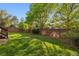 Backyard featuring a well-maintained lawn and a wooden fence at 104 Willowick Cir, Highlands Ranch, CO 80129
