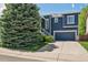 Charming two-story home with a covered porch, well-manicured landscaping, and an attached garage at 104 Willowick Cir, Highlands Ranch, CO 80129