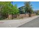 Charming two-story home with privacy fence, lush landscaping, and mature trees on a corner lot at 104 Willowick Cir, Highlands Ranch, CO 80129