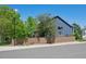 Charming two-story home with privacy fence, lush landscaping, and mature trees on a corner lot at 104 Willowick Cir, Highlands Ranch, CO 80129