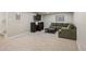 Spacious basement with neutral carpet and a comfortable seating area with a sofa at 986 S Jersey St, Denver, CO 80224