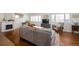 Bright, open living space features hardwood floors and a charming fireplace with decor at 986 S Jersey St, Denver, CO 80224