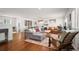 Bright, open living space features hardwood floors and a charming fireplace with decor at 986 S Jersey St, Denver, CO 80224