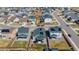 An aerial view of a modern homes featuring well-kept lawns and solar panels at 915 N Waterloo Ct, Aurora, CO 80018
