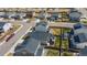 Backyard aerial view of houses with fenced yards, a small storage shed and trampoline at 915 N Waterloo Ct, Aurora, CO 80018