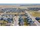 Areal view shows a well-planned community with uniform home designs and green spaces at 915 N Waterloo Ct, Aurora, CO 80018