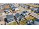 A high-angle perspective of homes in a neatly organized neighborhood with fenced in yards and driveways at 915 N Waterloo Ct, Aurora, CO 80018
