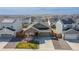 Aerial view of a home showcasing the landscaping, lawn and the neighborhood at 915 N Waterloo Ct, Aurora, CO 80018