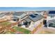 Aerial view of fenced backyard with lawn, patio and trampoline at 915 N Waterloo Ct, Aurora, CO 80018