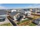 Aerial view of fenced backyard with a lawn, patio and a trampoline at 915 N Waterloo Ct, Aurora, CO 80018