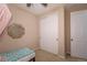 Neutral bedroom features closet with white doors and light carpet flooring at 915 N Waterloo Ct, Aurora, CO 80018