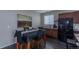 Charming dining area featuring a table with seating for four, with views of the kitchen and living room at 915 N Waterloo Ct, Aurora, CO 80018