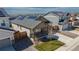 View of a single-Gathering home with gray siding and a cozy front porch in a residential neighborhood at 915 N Waterloo Ct, Aurora, CO 80018