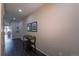 Inviting hallway with hardwood floors, neutral wall paint, decorative accents, and natural light at 915 N Waterloo Ct, Aurora, CO 80018